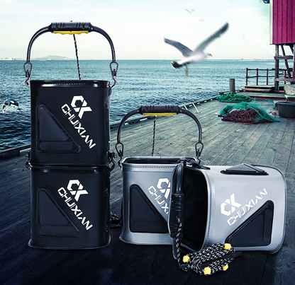 black and gray buckets on a dock with ocean and seagull background.