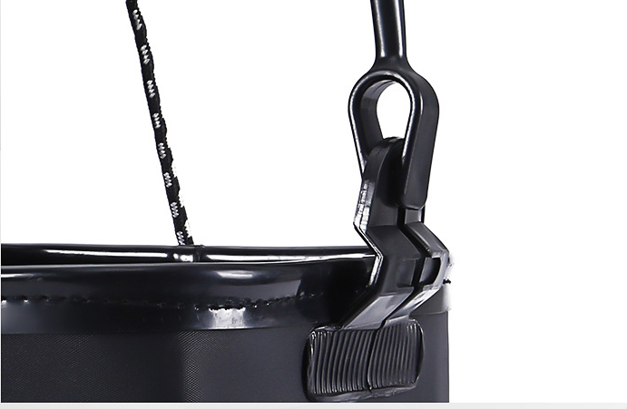 Close-up of a black plastic hook with a white background