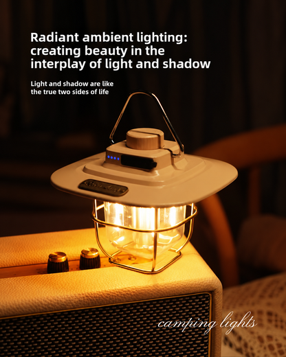 A vintage-style camping lantern with a cream-colored metal body and a warm yellow glowing light inside, placed on top of a tan leather suitcase in a dimly lit, cozy interior setting. White text overlays describe the ambient lighting effect.